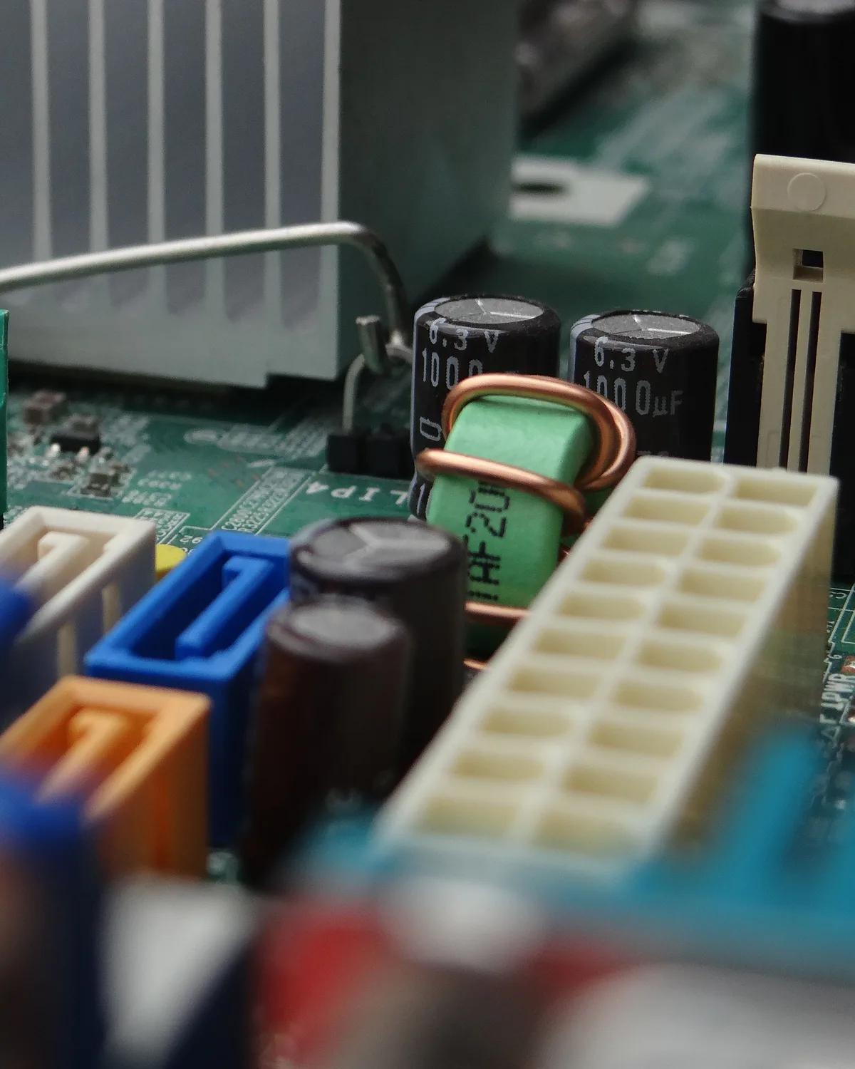 Close up of a server motherboard, capacitors and connectors kept in good order.